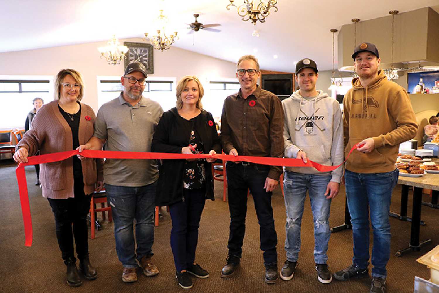 Cutting the ribbon at the new Rocanville golf clubhouse grand opening on Saturday, November 5. From left are clubhouse manager Crystal Rankin, Rocanville mayor Ron Reed, and golf board members Denise Kruppi, Ken Nixon (project manager), Ashley Howie, and Dylan Danielson.